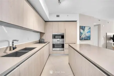 a kitchen with a sink and a stove at Stylish Apt - Beach View - Resort Access in Hollywood