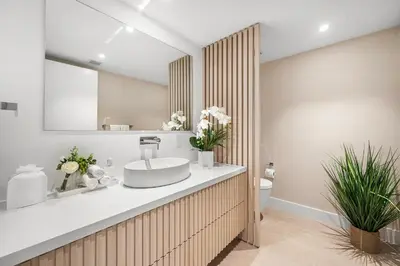 a bathroom with a sink and a toilet at 1 Bedroom Private Residence at Roney Palace - 607 in Miami Beach
