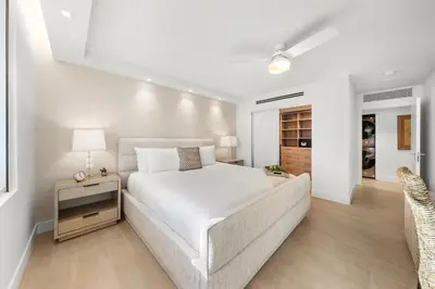 a white bedroom with a bed and a couch at 2 Bedroom Private Residence at Roney Palace -6072B in Miami Beach