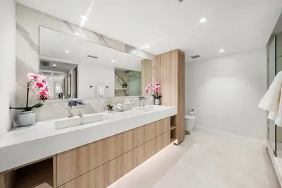a bathroom with two sinks and a large mirror at 5 Bedrooms Private Residence at Roney Palace -6078 in Miami Beach
