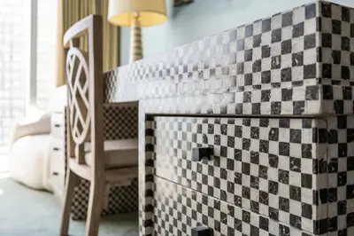 a fireplace in a room with a checkered wall at Stunning Apartment at Icon with Bay Views-Pool-Gym-Spa in Miami