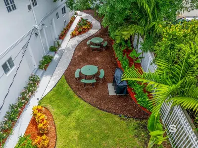 an overhead view of a garden with tables and flowers at Modern Studio - Gym & Parking Close to Aventura in Miami