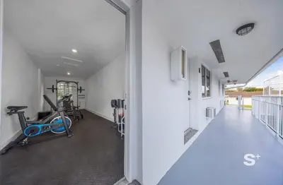an open hallway with a gym with a treadmill at Modern Studio - Gym & Parking Close to Aventura in Miami