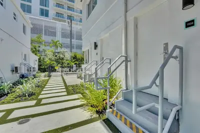 a group of stairs next to a building at Eden Collection Studio Steps to Beach in Fort Lauderdale