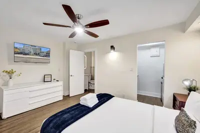 a bedroom with a bed and a ceiling fan at Eden Escape Walk to FLT Beach 1104 in Fort Lauderdale