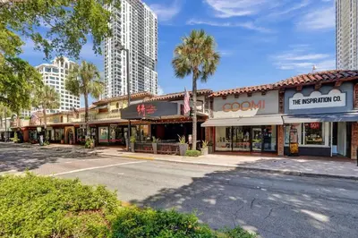 an empty street in a city with tall buildings at Eden Escape Walk to FLT Beach 1104 in Fort Lauderdale