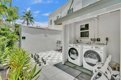 a laundry room with a washer and dryer at Eden Escape Walk to FLT Beach 2105 in Fort Lauderdale