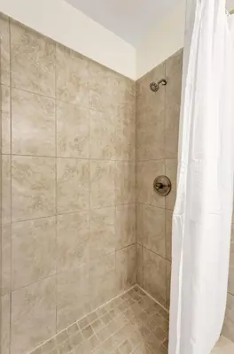 a bathroom with a shower with a shower curtain at Eden Escape Walk to FLT Beach 1103 in Fort Lauderdale