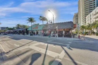 an empty street in a city with a building at Eden Escape Walk to FLT Beach 1102 in Fort Lauderdale