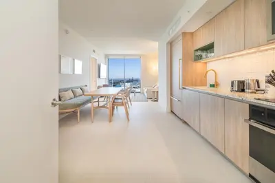 a kitchen and dining room with a table and chairs at Magnificent 3 Bedrooms in Downtown Miami with incredible views in Miami
