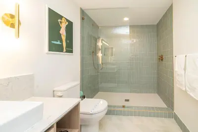 a bathroom with a shower and a toilet and a sink at Magnificent 3 Bedrooms in Downtown Miami with incredible views in Miami