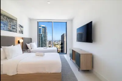 a hotel room with two beds and a television at Magnificent 3 Bedrooms in Downtown Miami with incredible views in Miami