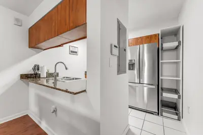 a kitchen with a sink and a refrigerator at Perfectly Located Miami 3BR with Stunning Views in Miami
