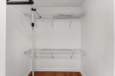 a white room with shelves on a wall at Perfectly Located Miami 3BR with Stunning Views in Miami