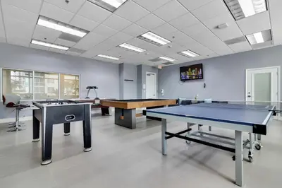 a room with two ping pong tables in it at Perfectly Located Miami 3BR with Stunning Views in Miami