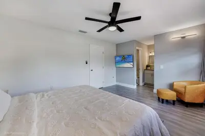 a bedroom with a bed and a ceiling fan at Spacious 4BR Miami Townhome with Communal Pool in Ives Estates