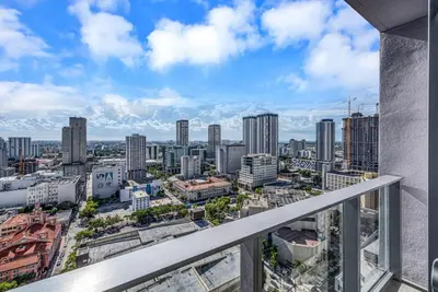 a view of a city from the balcony of a building at Stylish Studio and Den Across from Bayside Miami in Miami