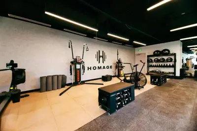 a room with a gym with bikes on the wall at Stylish Studio and Den Across from Bayside Miami in Miami
