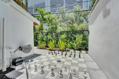 a chess board is on a patio with a chessboard at Eden Escape Studio 2103 Walk to FLT Beach in Fort Lauderdale