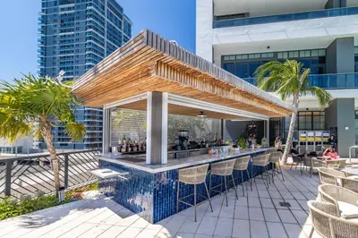 a bar on the rooftop of a building at Extraordinary Studio in Downtown Miami with incredible views in Miami