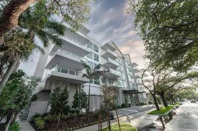 an exterior view of a white apartment building at Lux 2BR City-View Retreat in Hollywood, 2nd Floor in Hollywood