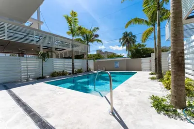 a swimming pool in the backyard of a house at Lux 2BR City-View Retreat in Hollywood, 2nd Floor in Hollywood