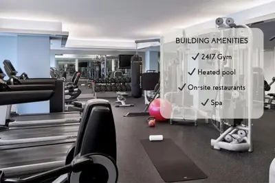 a gym with cardio equipment and a sign in the middle at Beach Club - Oceanfront Luxury, Resort Amenities, Balcony Views in Fort Lauderdale