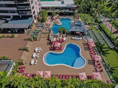 an aerial view of a resort with two swimming pools at Beachside Condo with Resort Amenities, Including Pools, Gym, and Bathtub 503 in Miami Beach