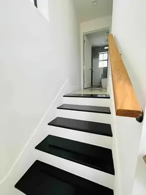 a staircase in a house with black and white at Tropical Guest House at VIlla Verde Miami in Miami