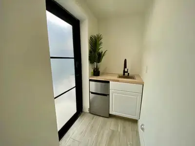 a kitchen with a sink and a window at Private Suite At Villa Verde Miami in Miami