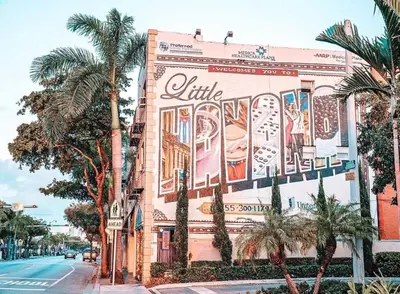a building with a mural on the side of it at Modern Bedroom In Central Miami Shared with host in Miami