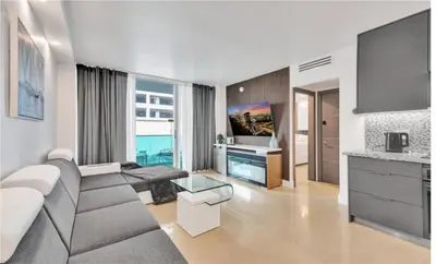 a living room with a couch and a table at Luxury Oceanfront 2 Bedroom ON THE BEACH 3 FLOOR in Hollywood