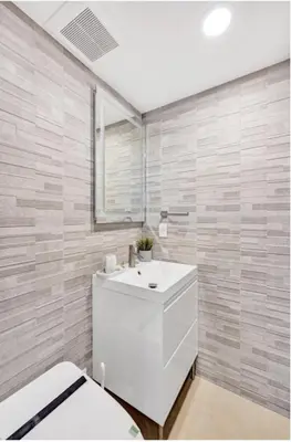a bathroom with a white sink and a toilet at Luxury Oceanfront 2 Bedroom ON THE BEACH 3 FLOOR in Hollywood