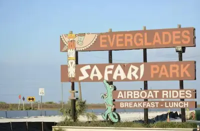 a sign for a safari park with street signs at 3BR Townhouse, Miami and the Keys in Homestead