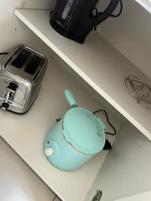 a blue computer mouse sitting on top of a shelf at 3BR Townhouse, Miami and the Keys in Homestead