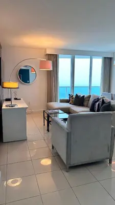 a living room with a couch and a table at Breathtaking Direct Bay Views 2 bedroom condo with parking in Miami
