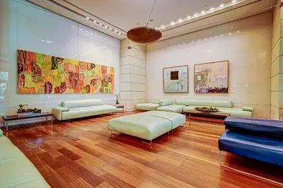 a large living room with couches and a painting at Breathtaking Direct Bay Views 2 bedroom condo with parking in Miami