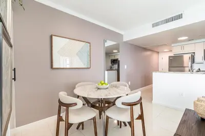 a kitchen and dining room with a table and chairs at Bay View Beauty 1 Bedroom condo in Coconut Grove Parking Included in Miami
