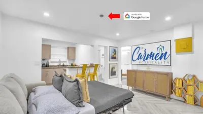a living room with a couch and a kitchen at Miami Designer Apartment Unit 2 in Miami