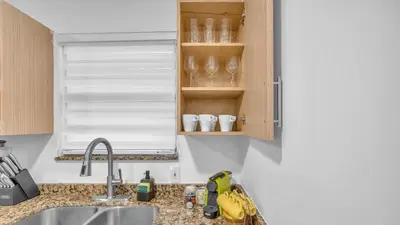 a kitchen counter with a sink and a window at Miami Designer Apartment Unit 2 in Miami