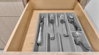 a box with forks and cutlery in it at Miami Designer Apartment Unit 2 in Miami
