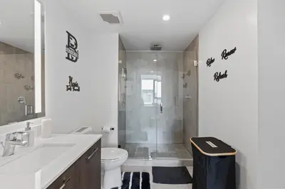 a bathroom with a shower and a toilet and a sink at Miami Luxury Suite Infinity Pool in Miami
