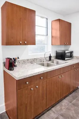 a kitchen with a sink and a microwave at Miami Designer Apartment Unit 3 in Miami