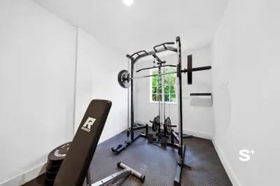 a room with a gym with a treadmill at Sleek 1-BD Miami Apt Gym, BBQ, Free Parking in Miami