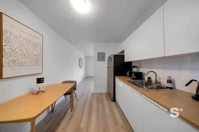 a kitchen with a sink and a counter top at Sleek 1-BD Miami Apt Gym, BBQ, Free Parking in Miami