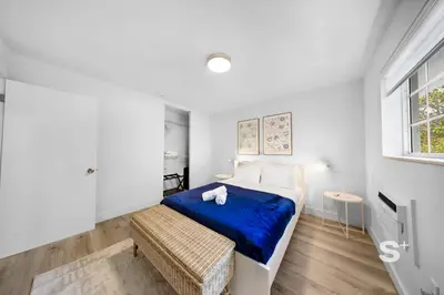 a white bedroom with a bed and a window at Sleek 1-BD Miami Apt Gym, BBQ, Free Parking in Miami