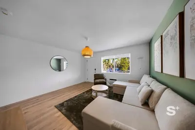 a living room with a couch and a table at Stylish 1-BD Apt Gym, BBQ, Free Parking in Miami