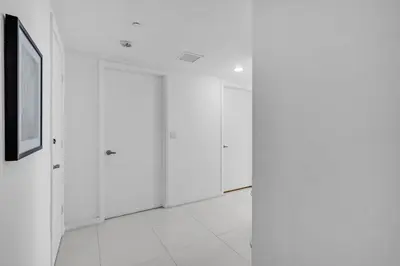 a white room with white doors and a picture at Moderne 2 bed 2 bath Residence in Miami
