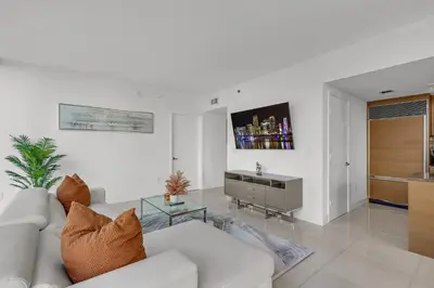 a living room with a white couch and a table at icon Brickell 2 bed 2bath at W residence in Miami
