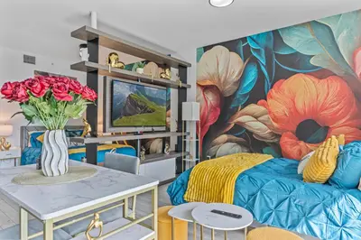 a bedroom with a mural of flowers on the wall at Miami Penthouse Infinity Pool in Miami